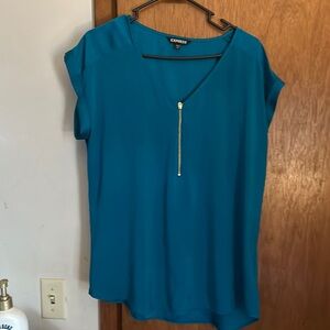 Teal, silky, women’s blouse.  Photographs blue but is actually teal